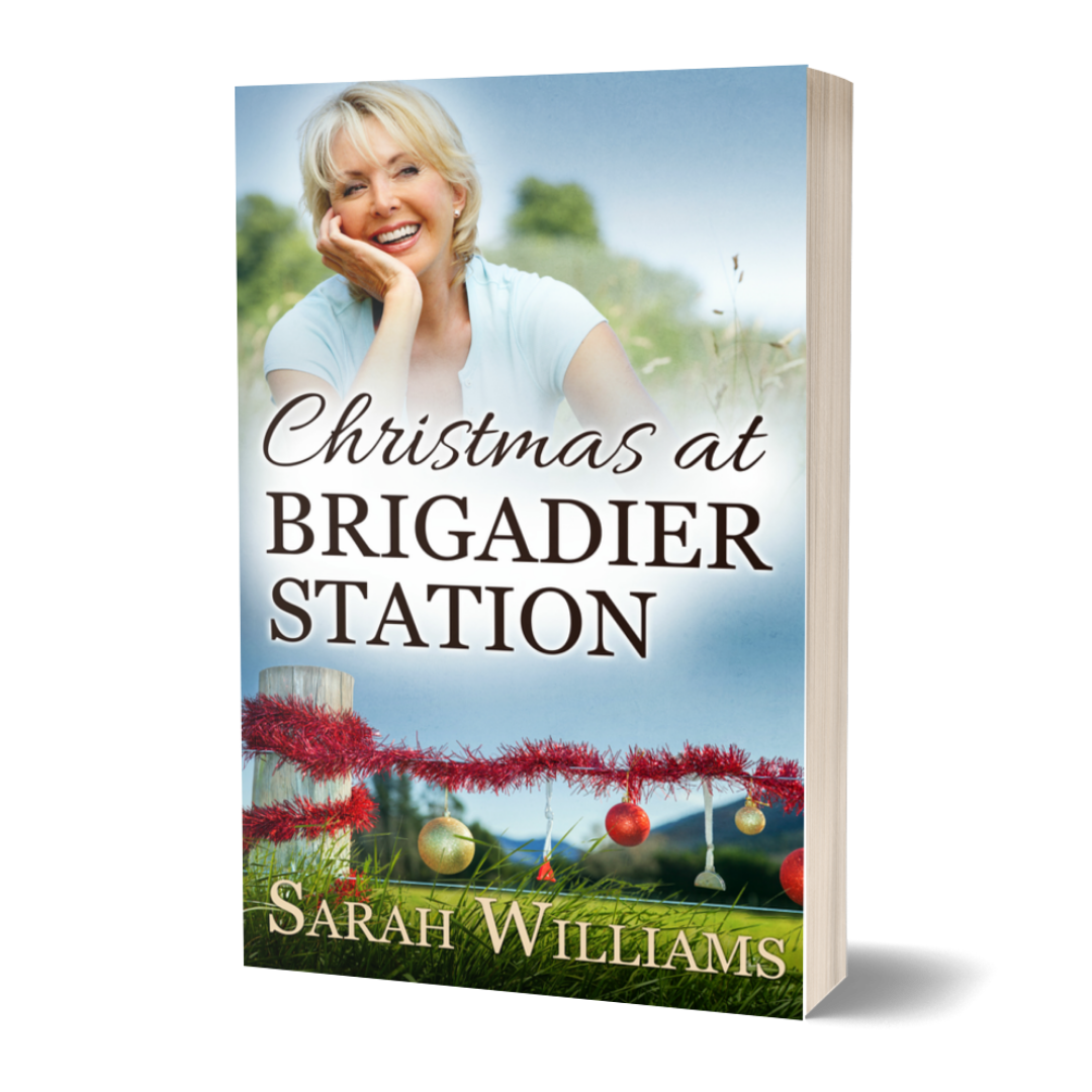 Book cover of 'Christmas at Brigadier Station' by Sarah Williams with a woman and festive elements.