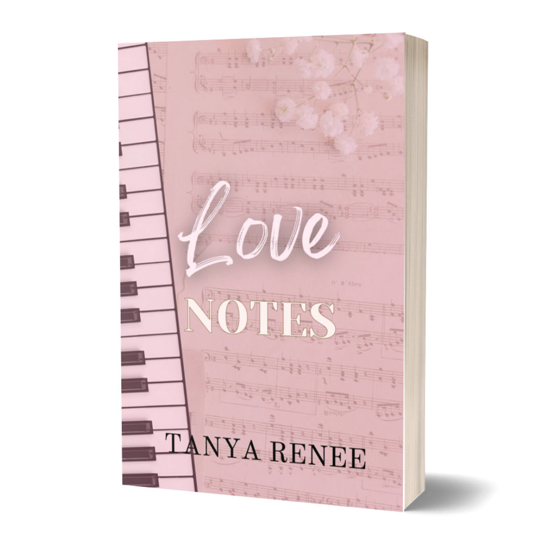 Notebook with music sheet design and 'Love Notes Tanya Renee' text on a white background