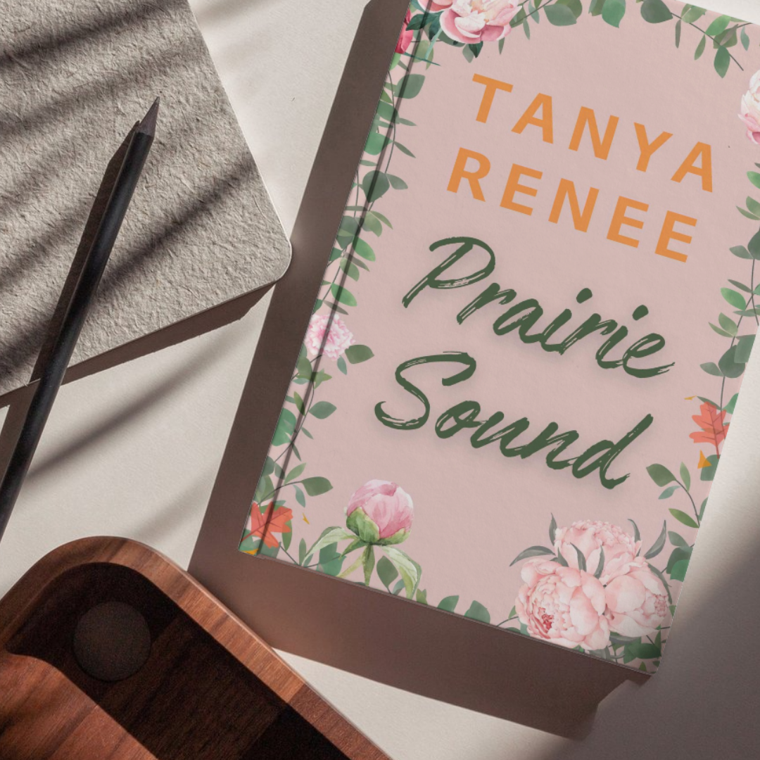 Book titled 'Prairie Sound' by Tanya Renee on a light surface with floral design