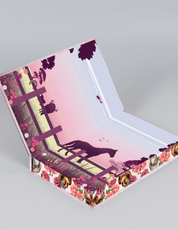 Decorative special edition book with floral and animal designs on a gray background