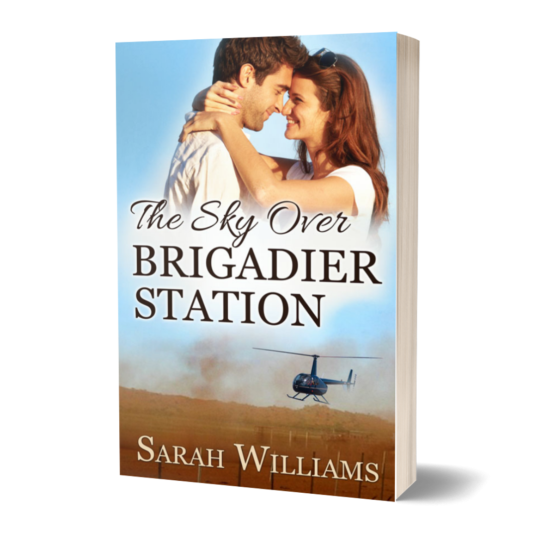 Book cover of 'The Sky Over Brigadier Station' by Sarah Williams with a couple embracing and a helicopter in the background.