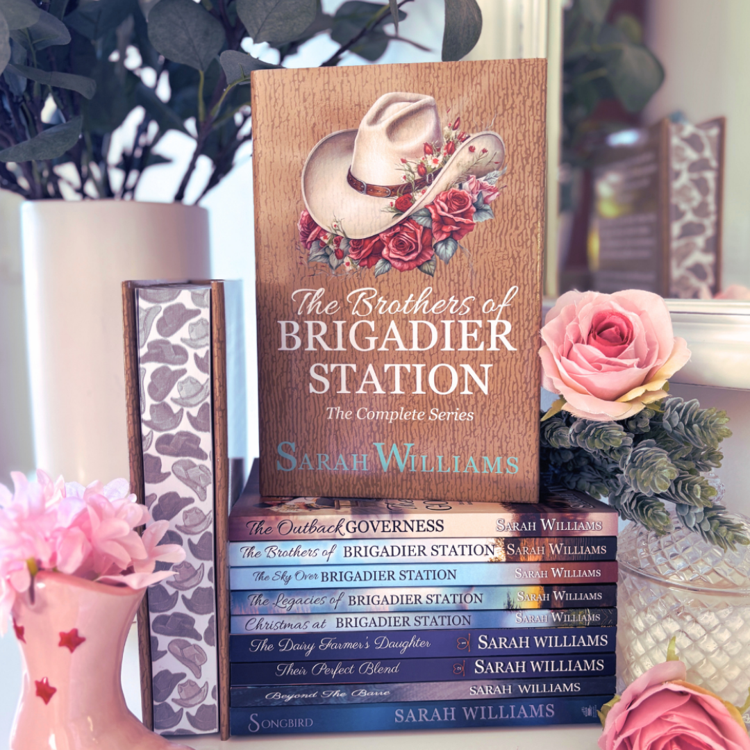 Stack of books titled 'The Brothers of Brigadier Station' by Sarah Williams with decorative elements.