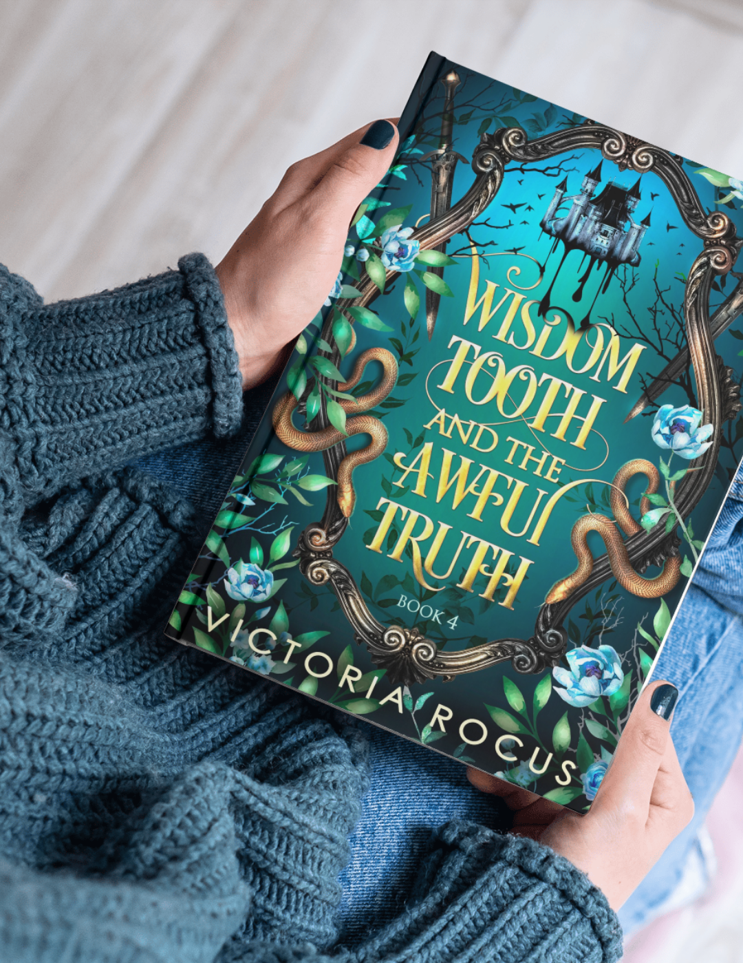 Book titled 'Wisdom Tooth and the Awful Truth' by Victoria Rocus held by a person wearing a blue sweater.